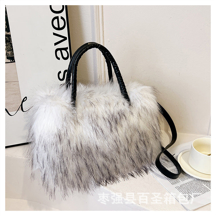 A Plush raccoon fur handbag