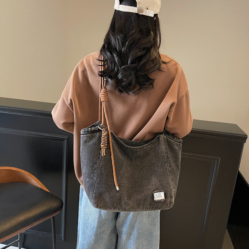 A denim shoulder bag