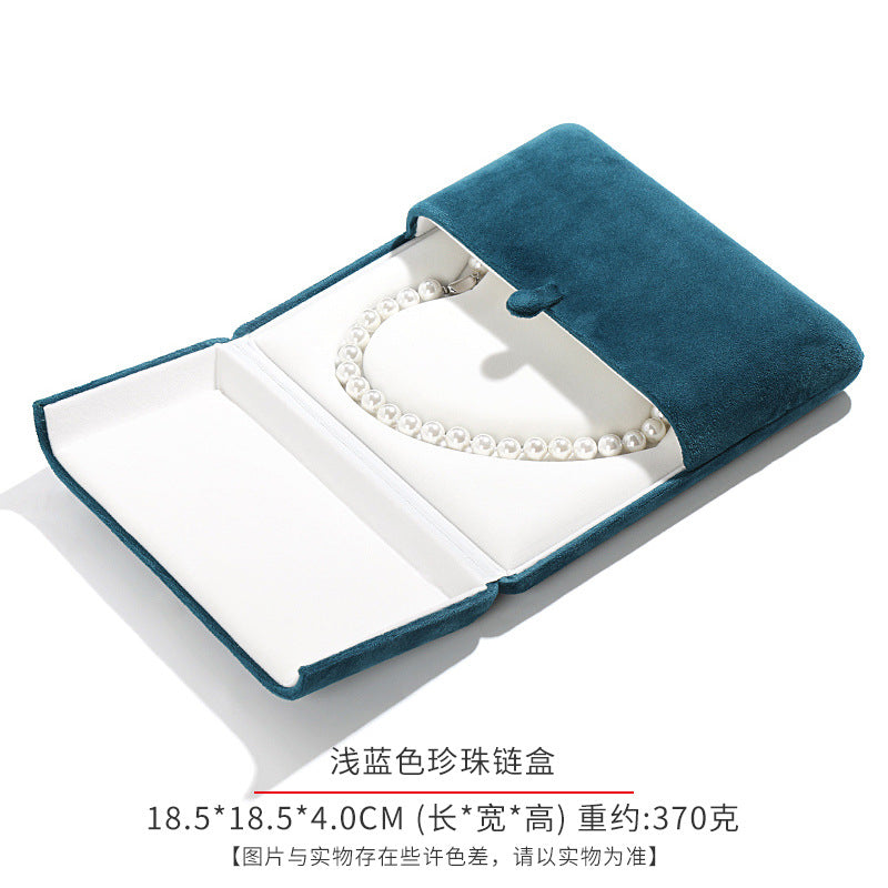 A heart shaped pearl necklace box