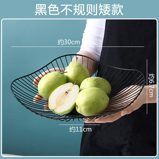 A fruit basket wrought iron storage basket
