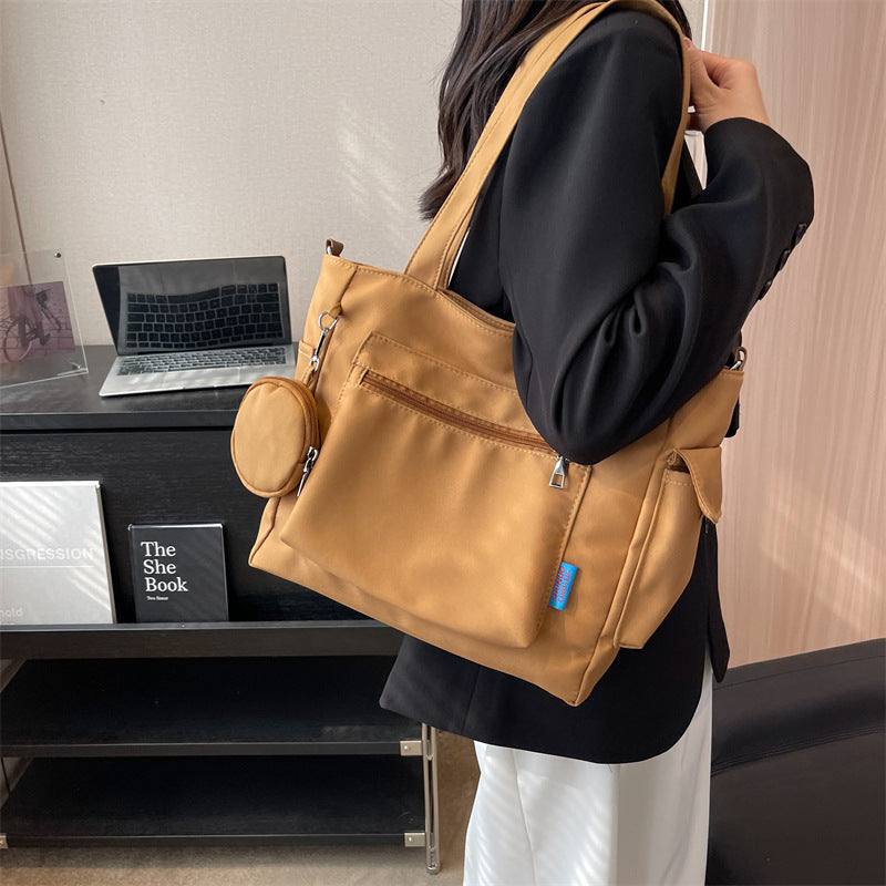 A new solid color canvas bag women's large-capacity shoulder bag student versatile tote bag hand bag messenger cloth bag