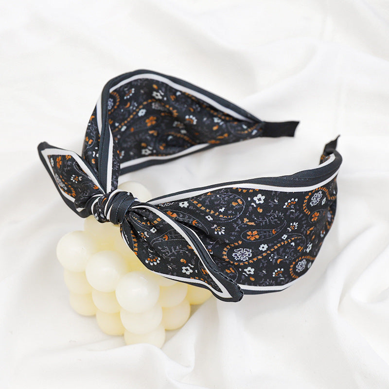 A Korean version of the new product headband fashion calico geometric wide edge headgear hair bundle go out bow hairpin