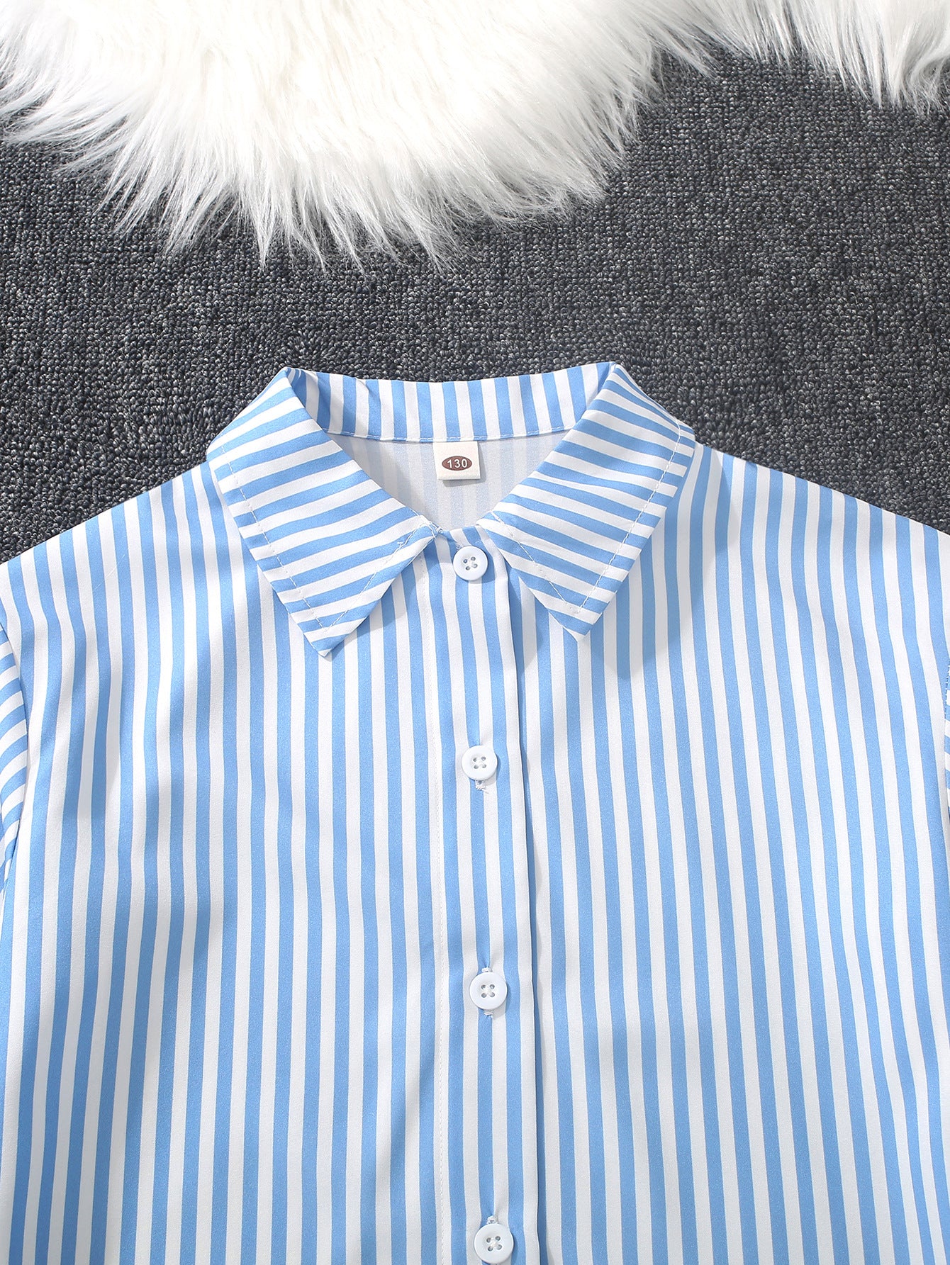 A medium and older children's girls' striped printed lapel neck long-sleeved shirt with white suspender vest and wide-leg trousers three-piece set