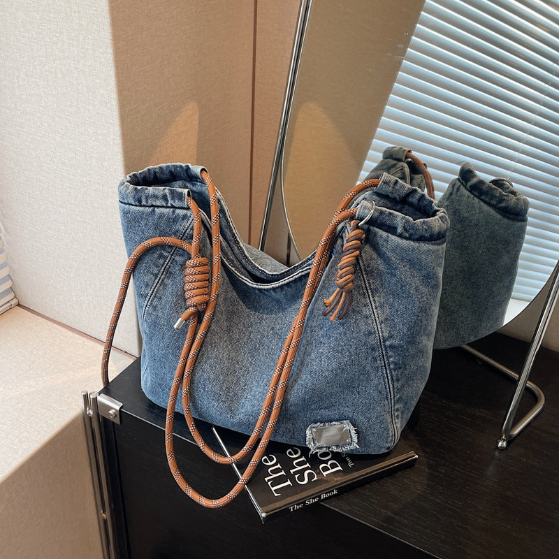 A denim shoulder bag