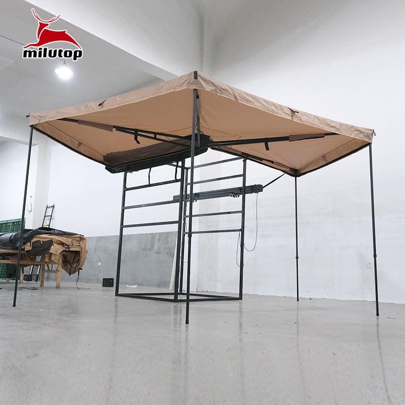 A double pole scalloped roof tent with lights