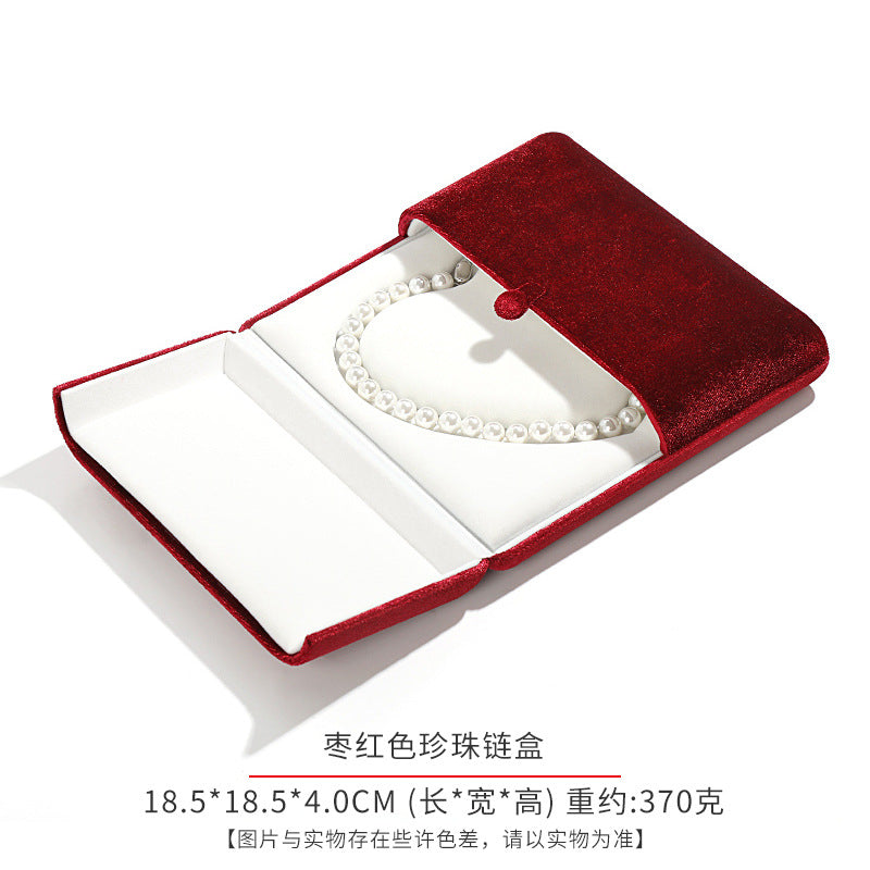 A heart shaped pearl necklace box