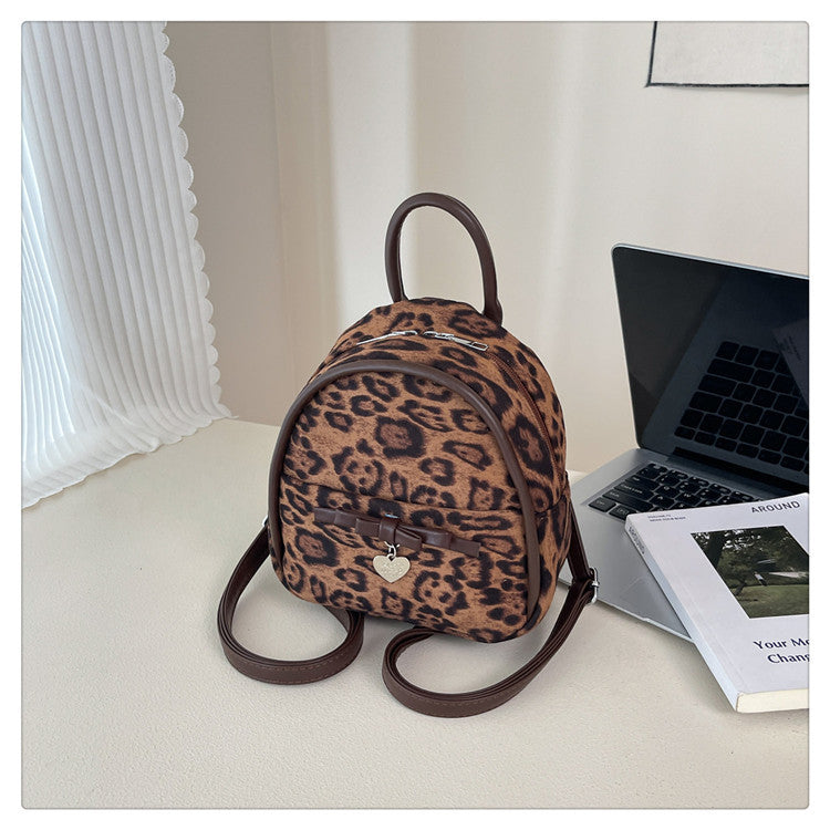 A flannel leopard print backpack