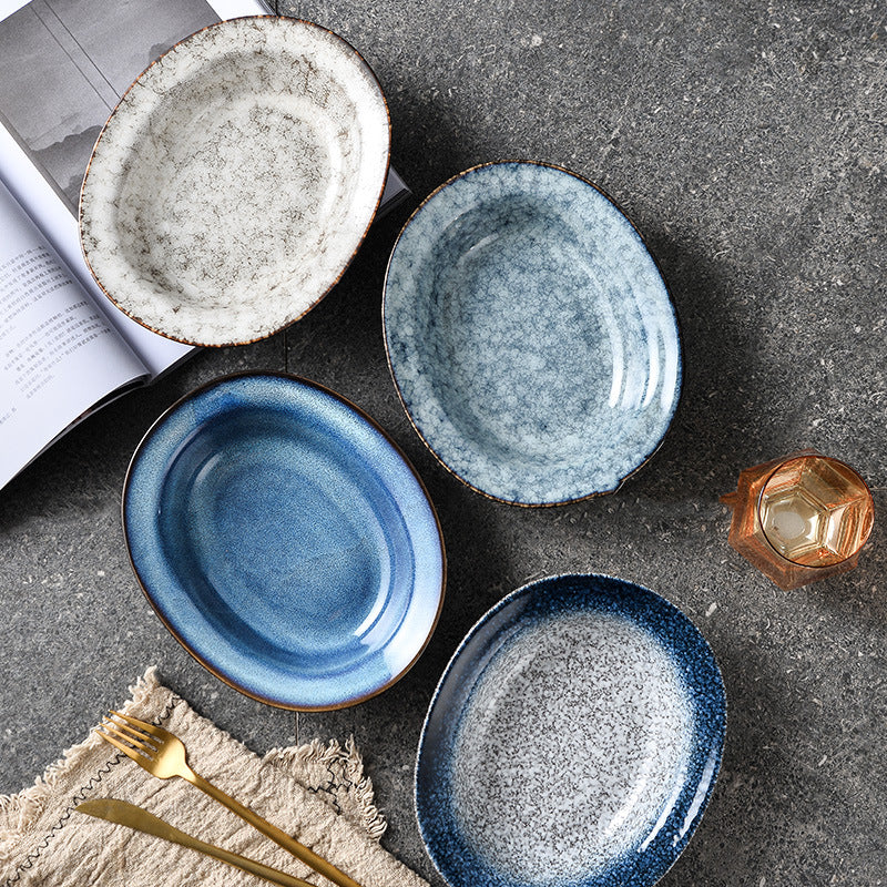 A Japanese creative goose egg-shaped ceramic plate vegetable plate household tableware simple western deep plate pasta plate salad plate