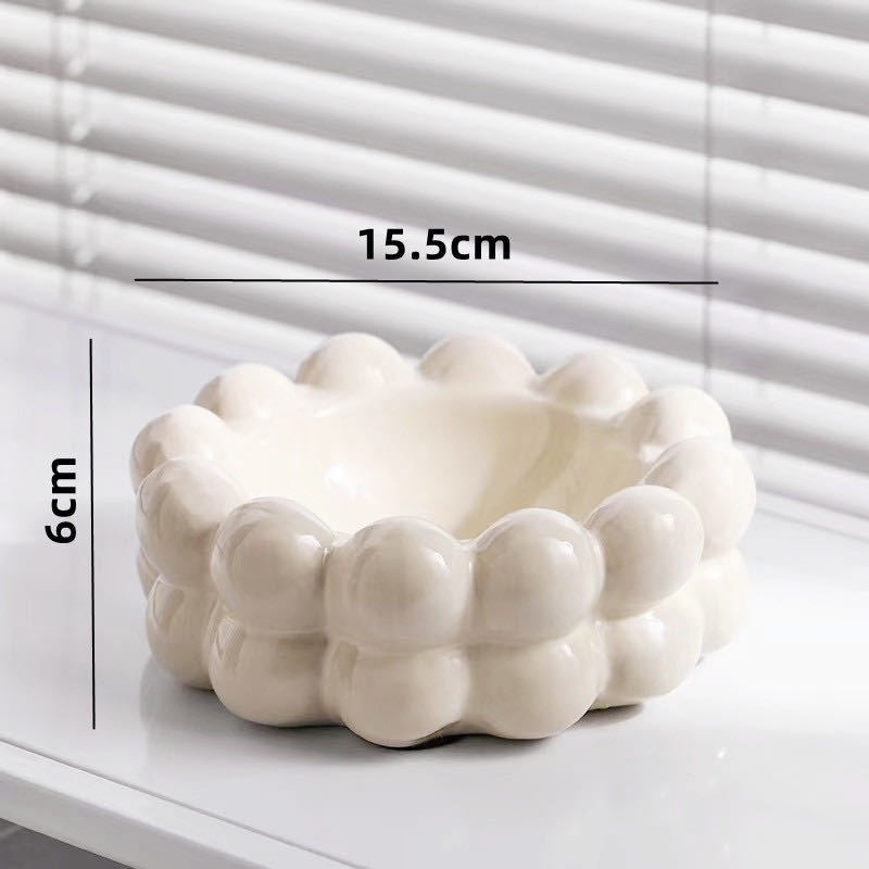 A ceramic tissue box ashtray
