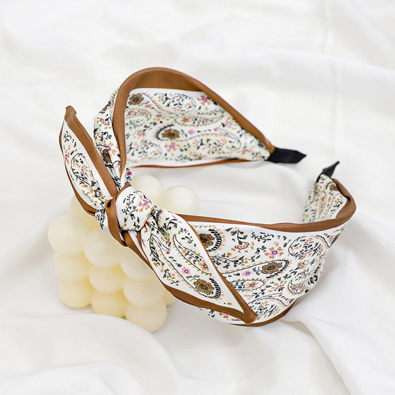 A Korean version of the new product headband fashion calico geometric wide edge headgear hair bundle go out bow hairpin