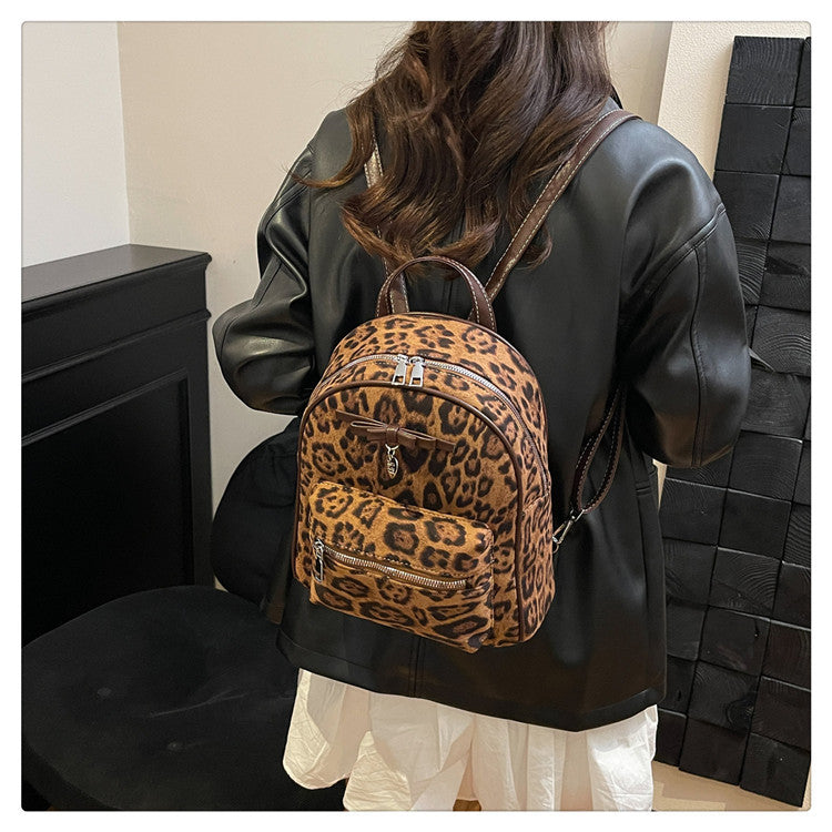 A flannel leopard print backpack