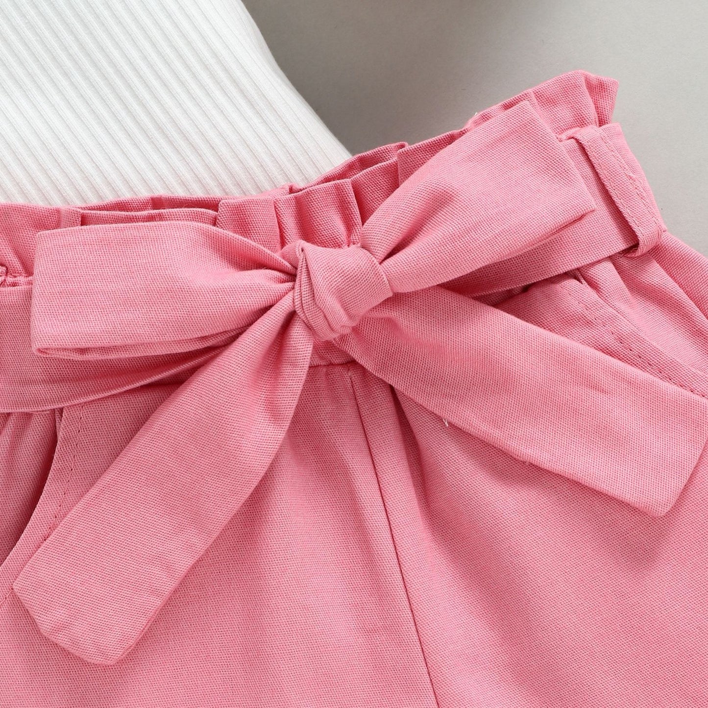 A European and American style summer small and medium-sized girl set with cotton pit strips and wooden ear edges, sleeveless top, solid color shorts, two-piece set - Mixbatch