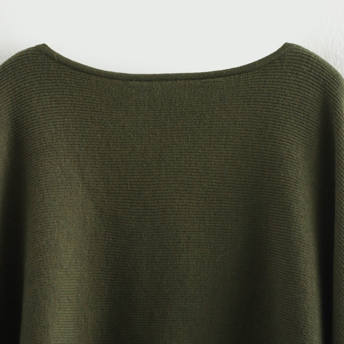 A cape knitted sweater