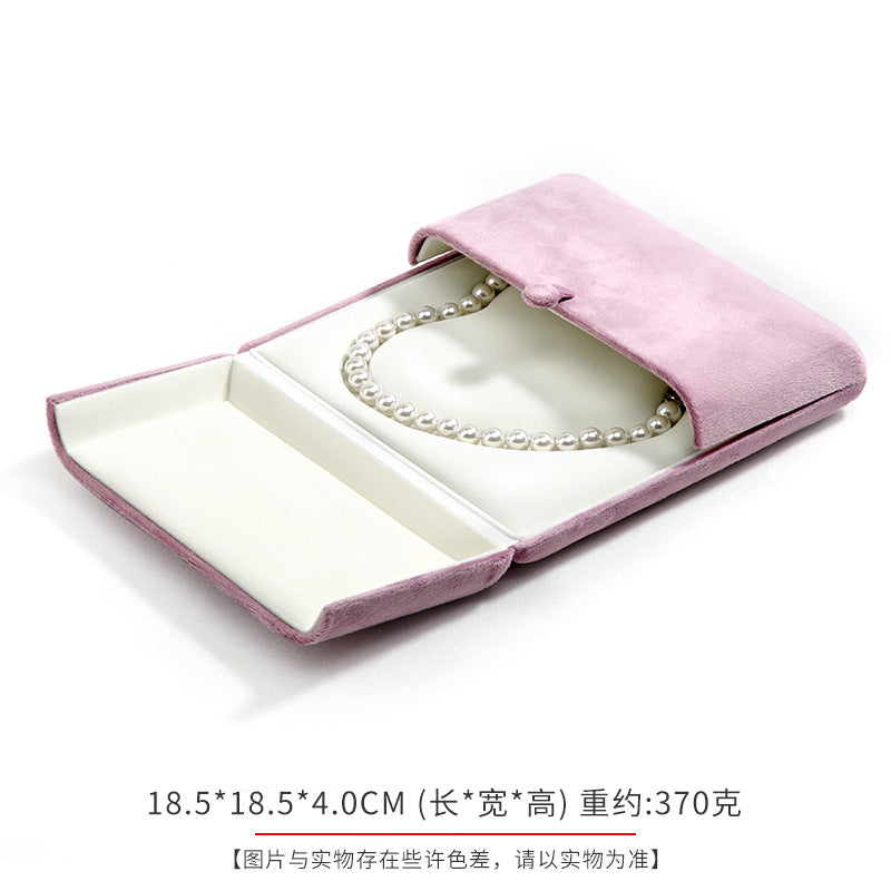 A heart shaped pearl necklace box