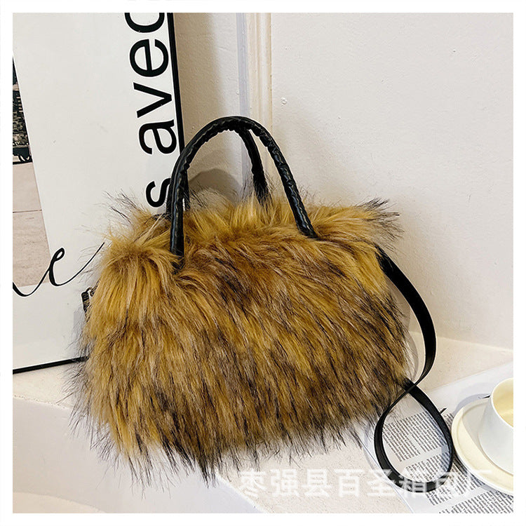 A Plush raccoon fur handbag