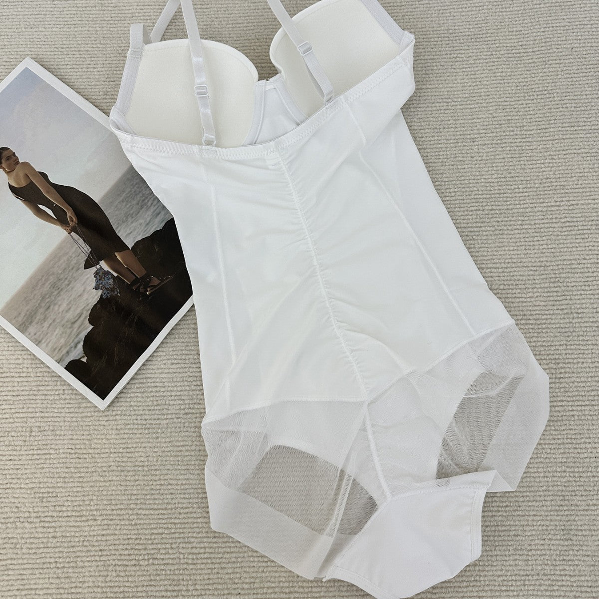 A body sculpting onesie with bra