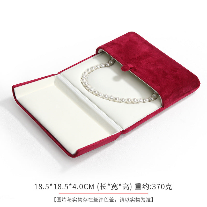 A heart shaped pearl necklace box