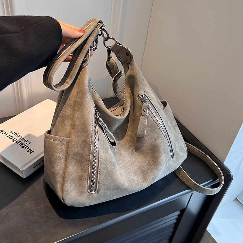 A handbag shoulder messenger bag