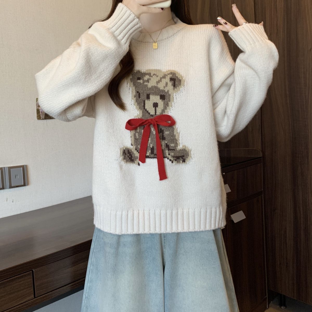 A cartoon crew neck sweater