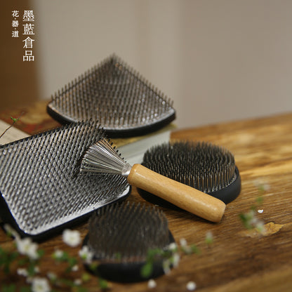 A Stainless Steel Flower Arrangement Base Needle Tool