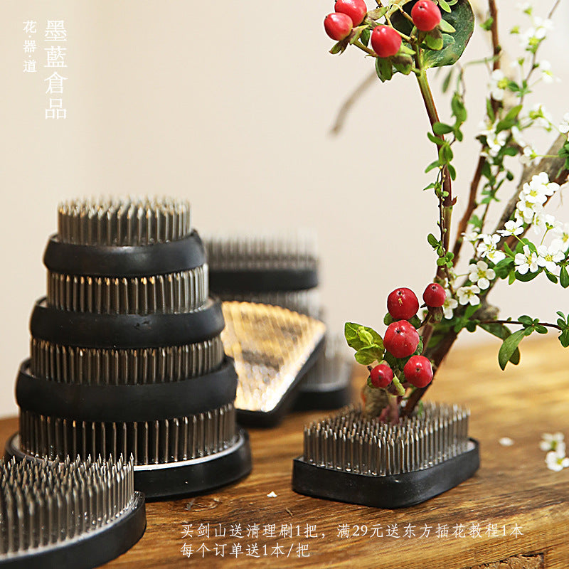 A Stainless Steel Flower Arrangement Base Needle Tool