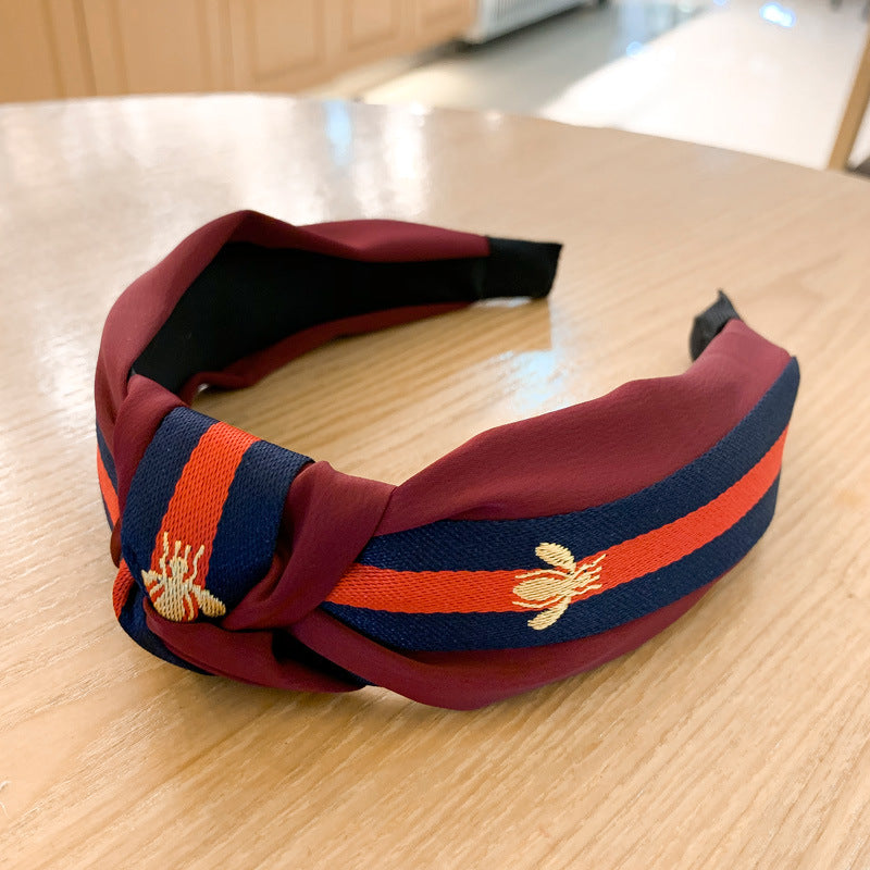 A lady bee knotted headband, Korean version, wide-sided simple headband, high cranial top stripe, wide-sided pressure headband, non-slip.