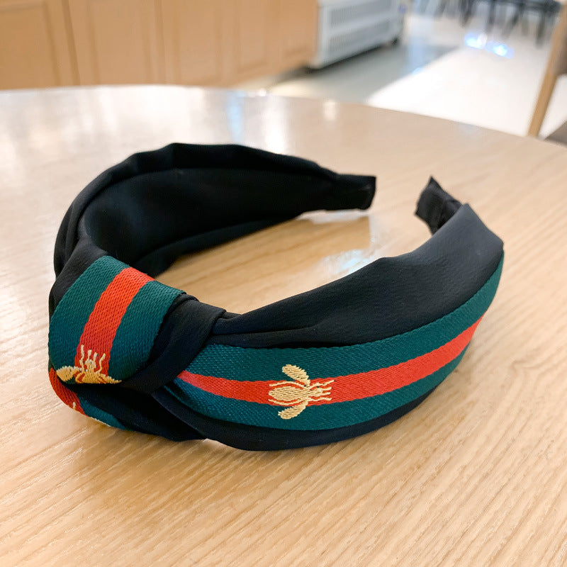 A lady bee knotted headband, Korean version, wide-sided simple headband, high cranial top stripe, wide-sided pressure headband, non-slip.