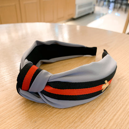 A lady bee knotted headband, Korean version, wide-sided simple headband, high cranial top stripe, wide-sided pressure headband, non-slip.