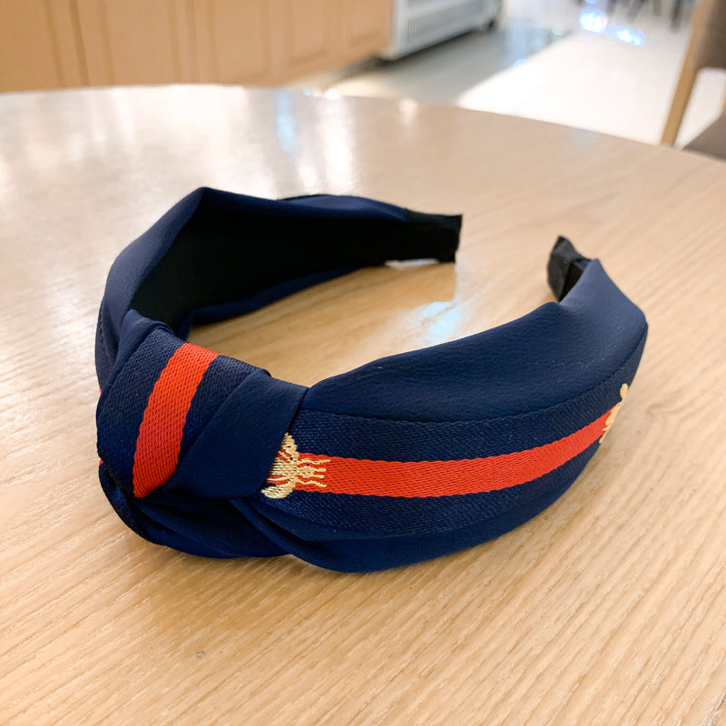 A lady bee knotted headband, Korean version, wide-sided simple headband, high cranial top stripe, wide-sided pressure headband, non-slip.