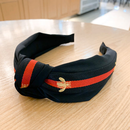A lady bee knotted headband, Korean version, wide-sided simple headband, high cranial top stripe, wide-sided pressure headband, non-slip.