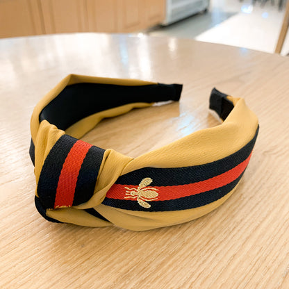 A lady bee knotted headband, Korean version, wide-sided simple headband, high cranial top stripe, wide-sided pressure headband, non-slip.