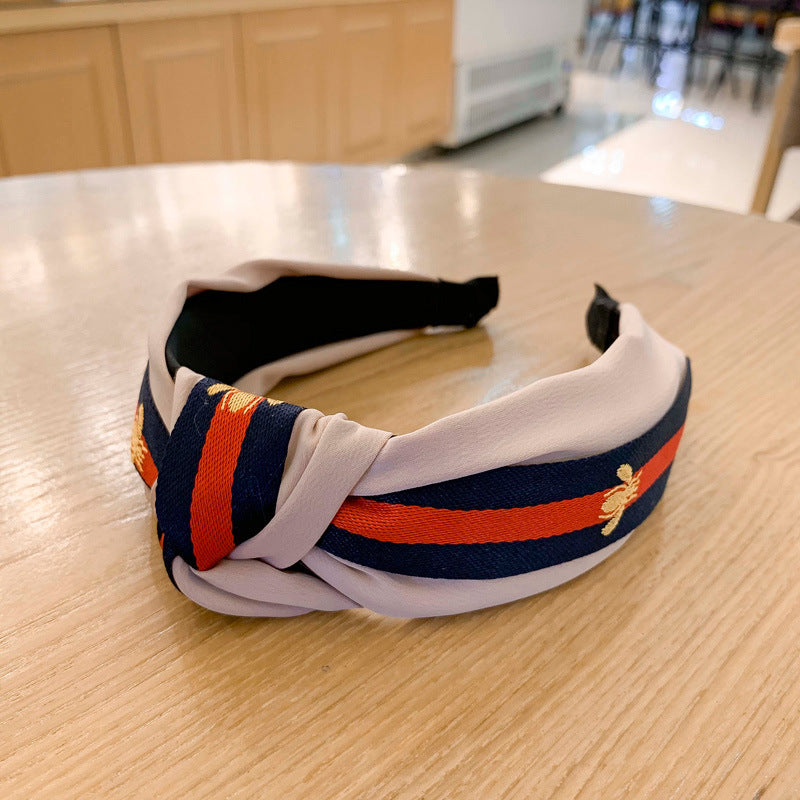 A lady bee knotted headband, Korean version, wide-sided simple headband, high cranial top stripe, wide-sided pressure headband, non-slip.