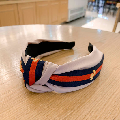 A lady bee knotted headband, Korean version, wide-sided simple headband, high cranial top stripe, wide-sided pressure headband, non-slip.