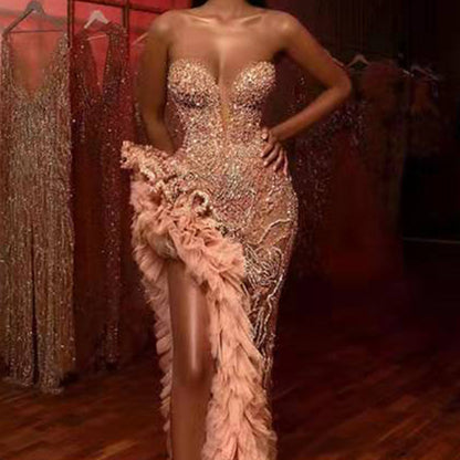 A summer new European and American women's clothing Amazon dress fringed tail sexy gold tube top evening dress