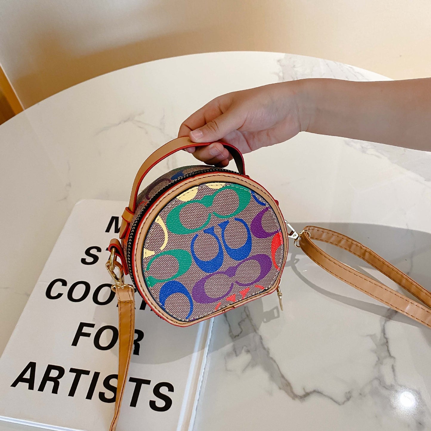 A European and American trend children's bag personalized letters niche Internet celebrity girl hand carry messenger bag baby accessories round bag