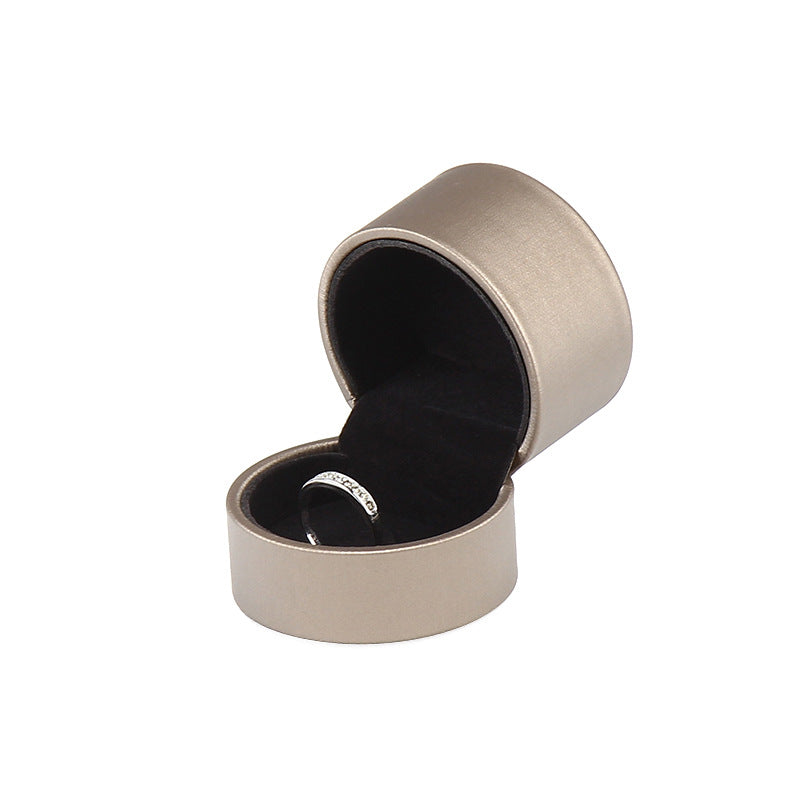 A rounded brushed leather jewelry box