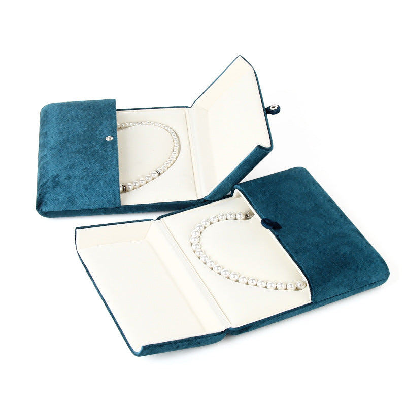 A heart shaped pearl necklace box