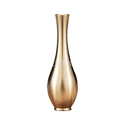 A brass mini vase ornament