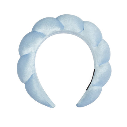 A towel fleece sponge twist headband
