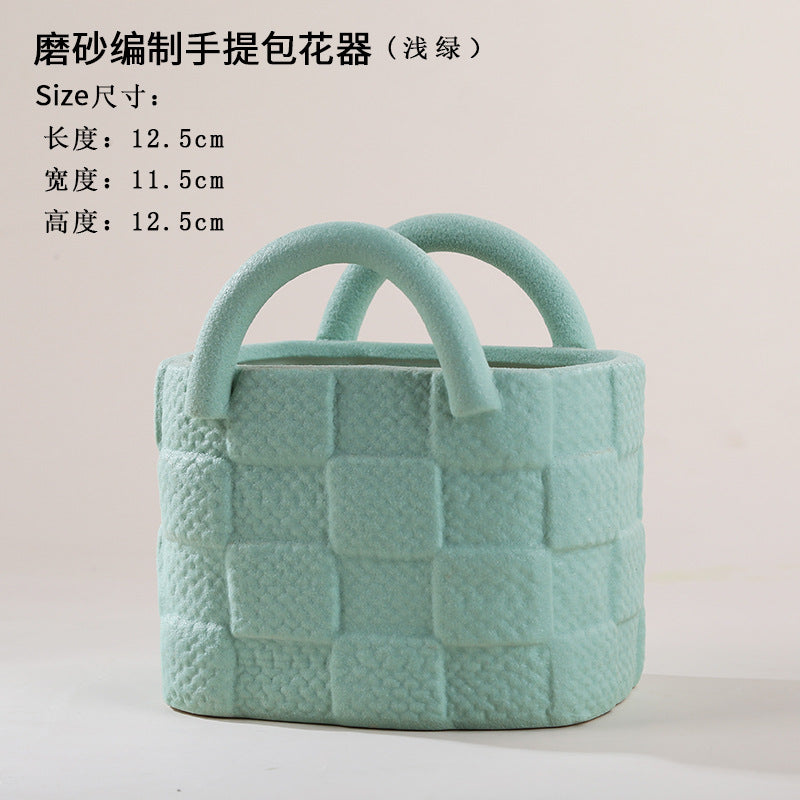 A ceramic handbag vase ornament