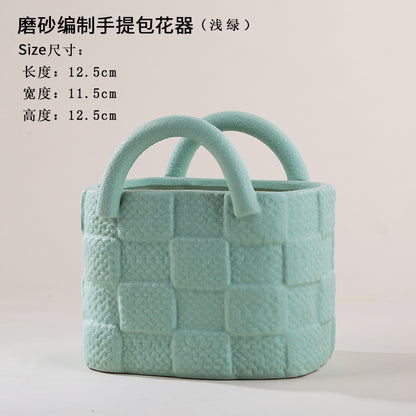 A ceramic handbag vase ornament