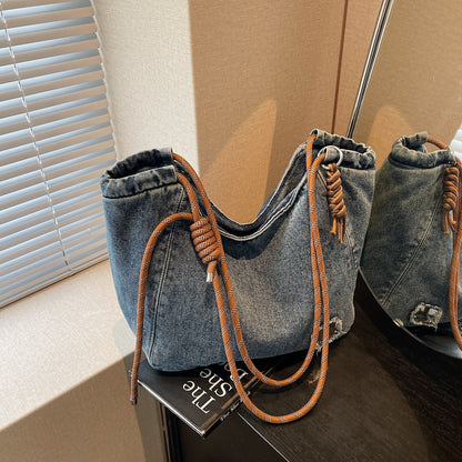 A denim shoulder bag
