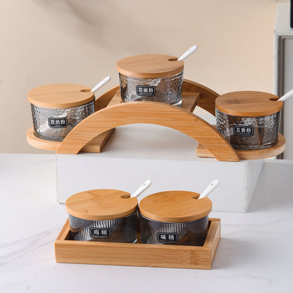 A kitchen seasoning box bamboo cover glass jar