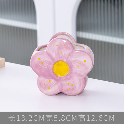 A ceramic pen holder storage ornament