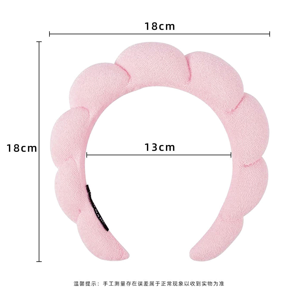 A towel fleece sponge twist headband
