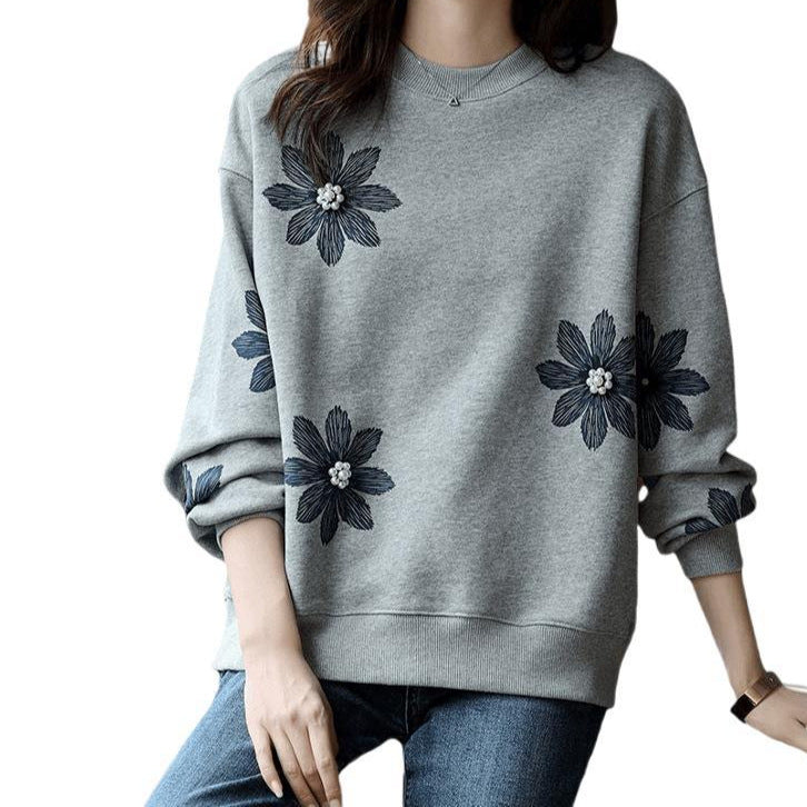 A flower beaded sweater