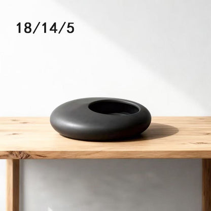 A ceramic flower pot potting container