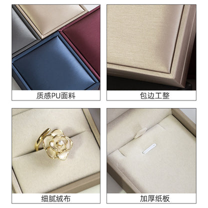A brushed PU leather bronzing LOGO jewelry box