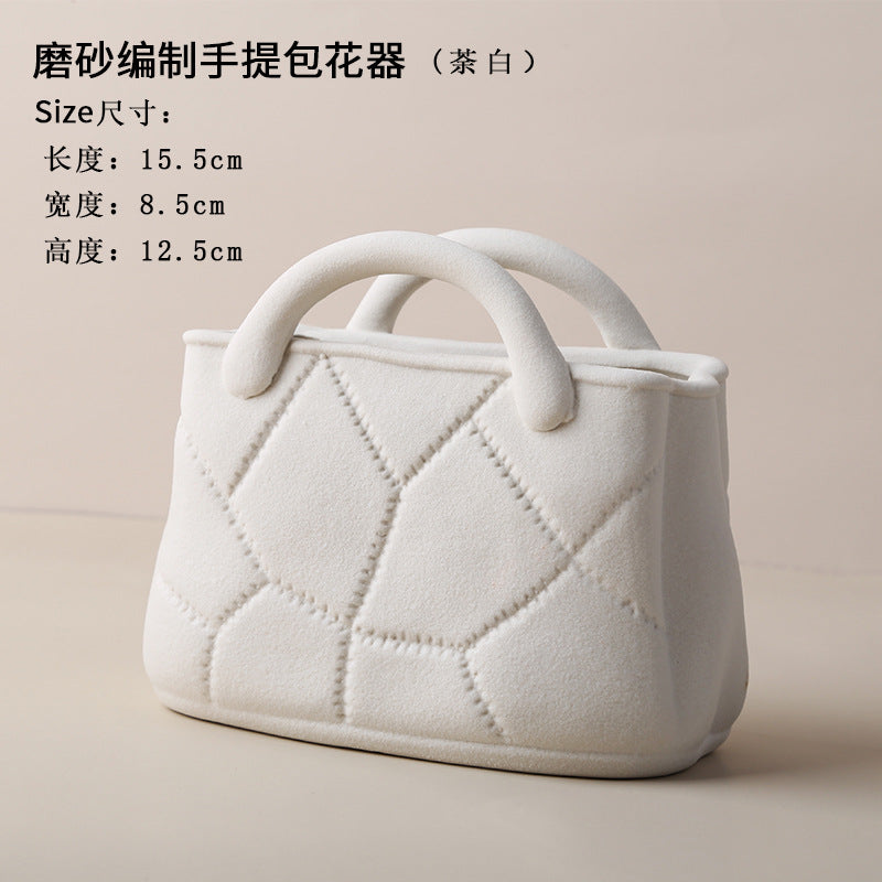 A ceramic handbag vase ornament