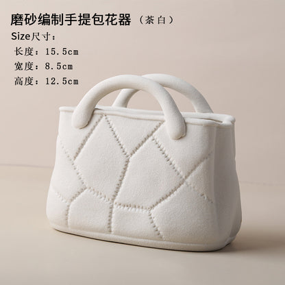 A ceramic handbag vase ornament